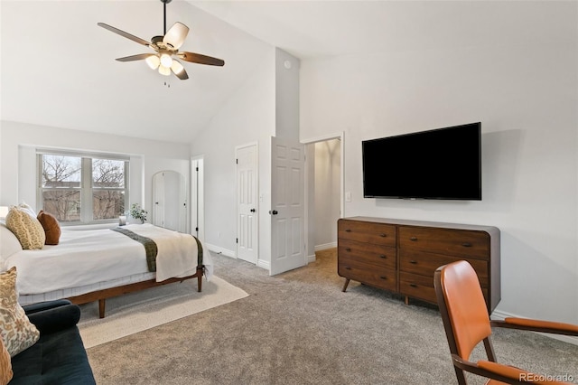 carpeted bedroom featuring high vaulted ceiling and ceiling fan