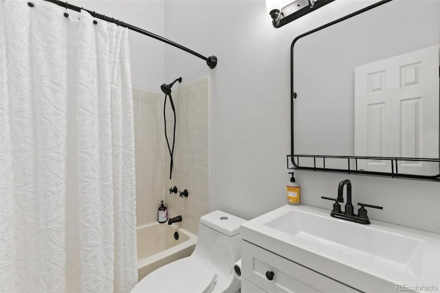 full bathroom featuring vanity, shower / bath combination with curtain, and toilet