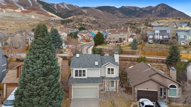 drone / aerial view featuring a mountain view