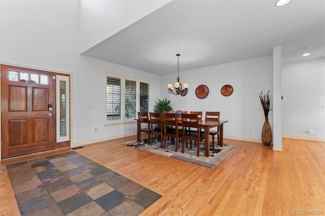 7071 Turweston Ln, Castle Pines, CO 80108 - dining space with a chandelier, recessed lighting, wood finished floors, and baseboards