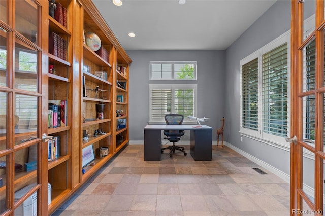 7071 Turweston Ln, Castle Pines, CO 80108 - home office with baseboards, recessed lighting, and light stone finish floors