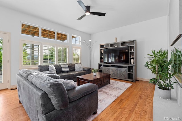 7071 Turweston Ln, Castle Pines, CO 80108 - living area featuring ceiling fan, wood finished floors, and baseboards