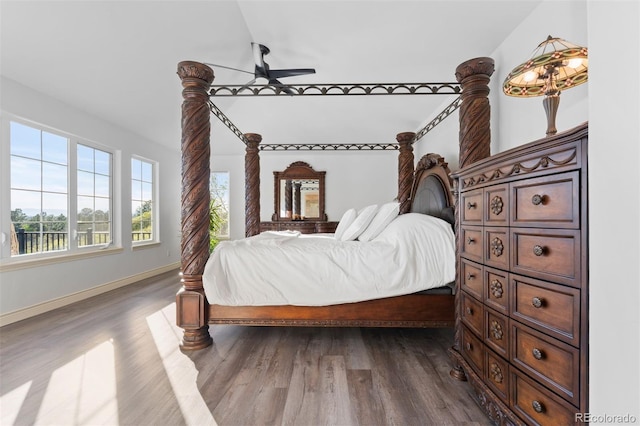 7071 Turweston Ln, Castle Pines, CO 80108 - bedroom featuring dark wood-style flooring and baseboards