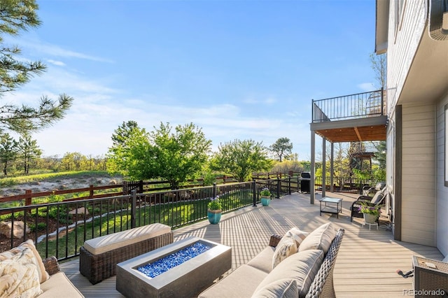 7071 Turweston Ln, Castle Pines, CO 80108 - deck featuring an outdoor living space with a fire pit
