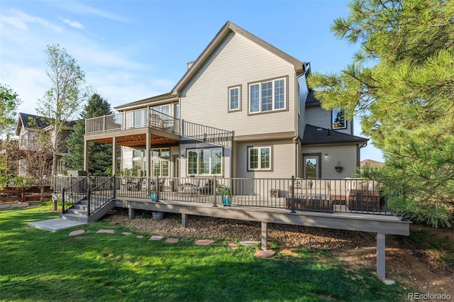 7071 Turweston Ln, Castle Pines, CO 80108 - back of house with a balcony, a yard, and a wooden deck