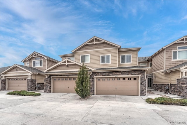 14902 E Poundstone Dr, Aurora, CO 80015 - view of front facade featuring stone siding and concrete driveway