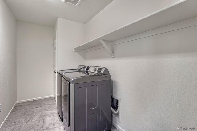 14902 E Poundstone Dr, Aurora, CO 80015 - laundry room featuring separate washer and dryer and baseboards