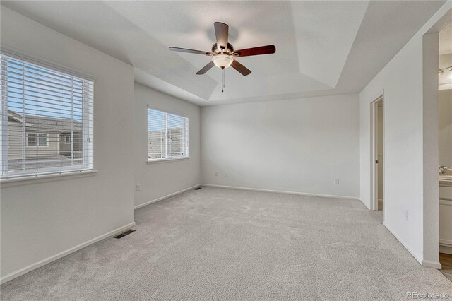 14902 E Poundstone Dr, Aurora, CO 80015 - carpeted spare room with a tray ceiling, a ceiling fan, and baseboards