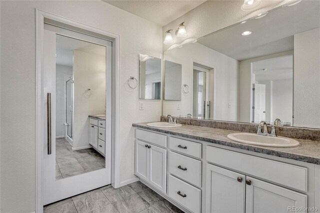 14902 E Poundstone Dr, Aurora, CO 80015 - full bath with double vanity and a shower stall