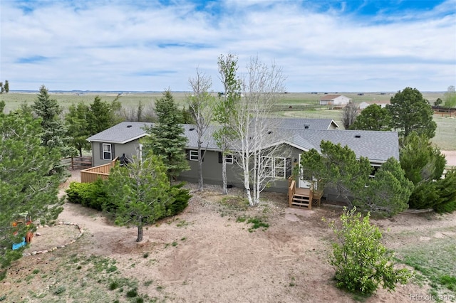 16580 Sagecreek Rd, Peyton, CO 80831 - back of house featuring roof with shingles and a deck