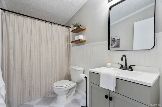 16580 Sagecreek Rd, Peyton, CO 80831 - bathroom with a textured ceiling, toilet, vanity, wainscoting, and a shower with shower curtain