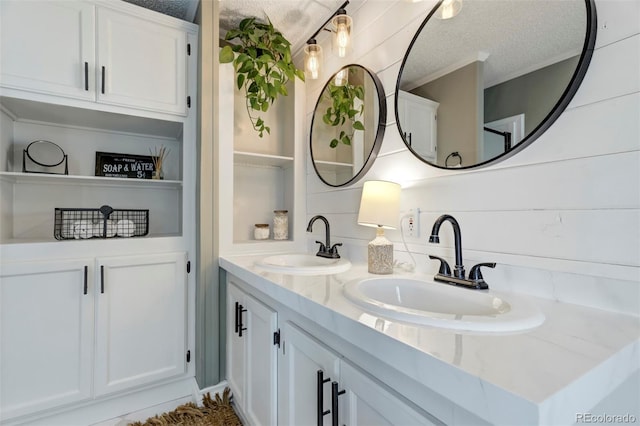 16580 Sagecreek Rd, Peyton, CO 80831 - full bath featuring double vanity and a textured ceiling