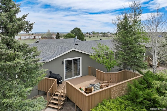 16580 Sagecreek Rd, Peyton, CO 80831 - rear view of property with roof with shingles and a deck