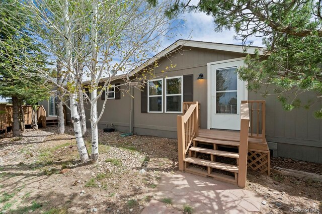 16580 Sagecreek Rd, Peyton, CO 80831 - view of front facade featuring a deck