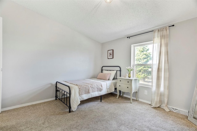 16580 Sagecreek Rd, Peyton, CO 80831 - carpeted bedroom featuring a textured ceiling and baseboards