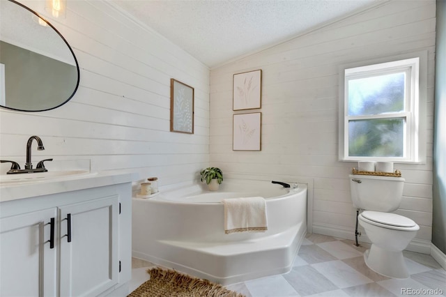 16580 Sagecreek Rd, Peyton, CO 80831 - full bathroom featuring vanity, a bath, wooden walls, toilet, and a textured ceiling