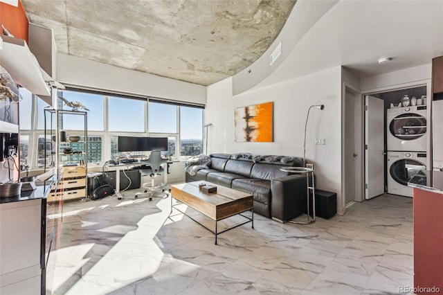 living room with stacked washer and dryer