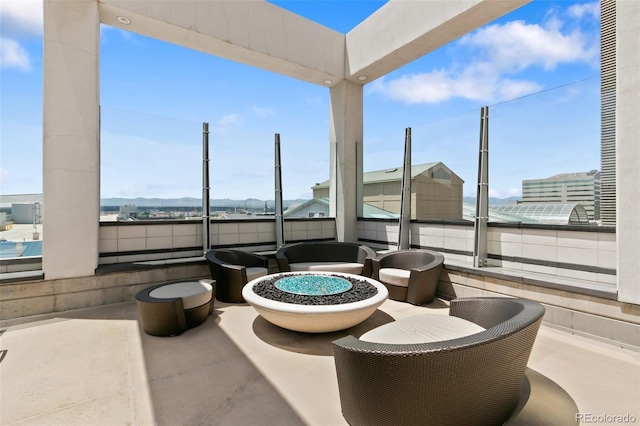 view of patio featuring an outdoor fire pit