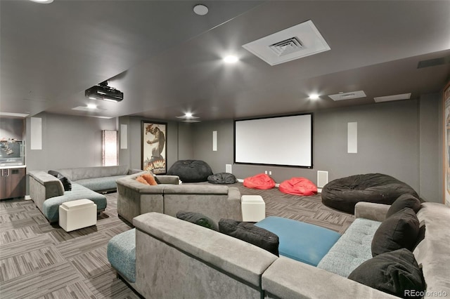 cinema room with light colored carpet