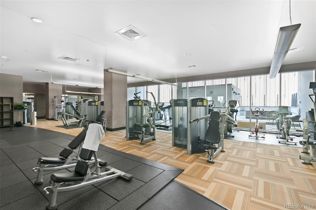 workout area featuring floor to ceiling windows