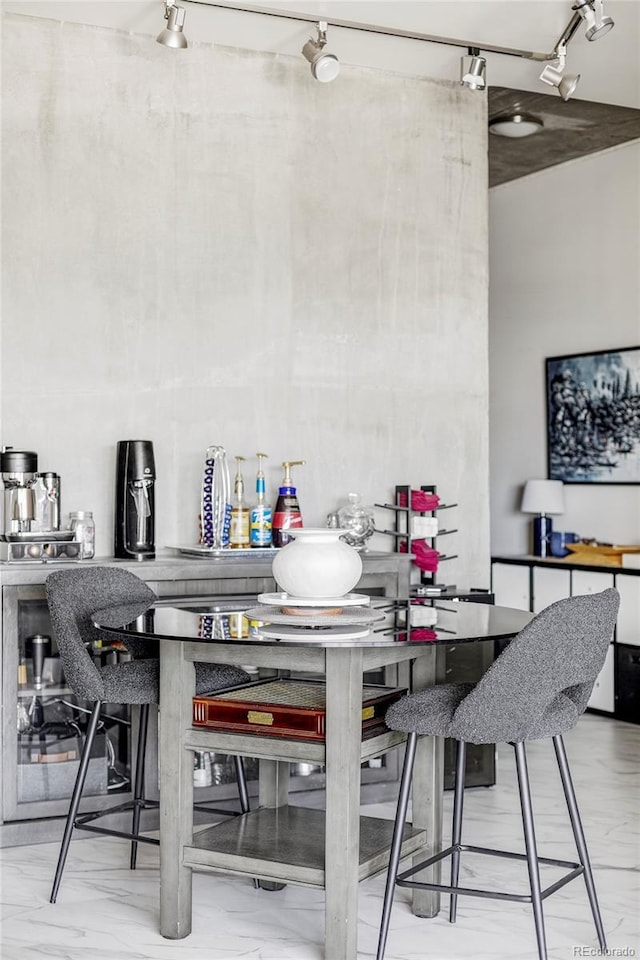 891 14th St Unit 2816, Denver, CO 80202 - dining room featuring rail lighting and marble look tiles