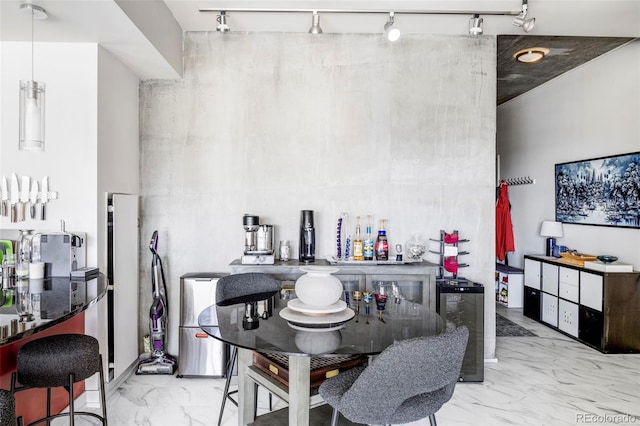 891 14th St Unit 2816, Denver, CO 80202 - dining space featuring rail lighting and marble look tile flooring