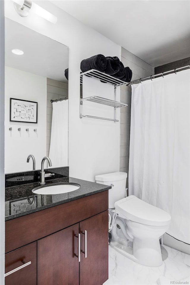 891 14th St Unit 2816, Denver, CO 80202 - bathroom featuring marble look tile flooring, vanity, toilet, and a shower with curtain