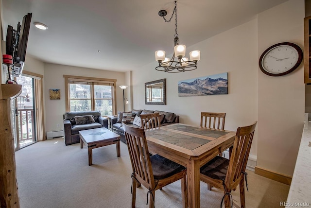 105 Wheeler Cir Unit 334, Frisco, CO 80443 - dining area with baseboard heating, a chandelier, and light colored carpet