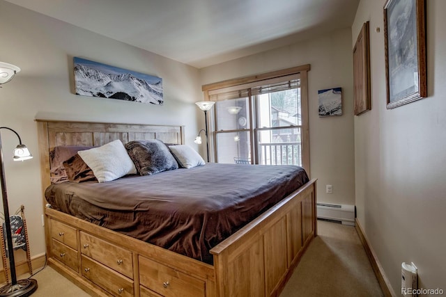 105 Wheeler Cir Unit 334, Frisco, CO 80443 - bedroom featuring a baseboard radiator and light colored carpet