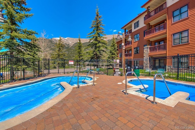 105 Wheeler Cir Unit 334, Frisco, CO 80443 - community pool with a mountain view and a patio area