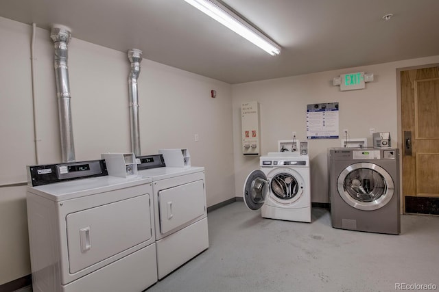 105 Wheeler Cir Unit 334, Frisco, CO 80443 - community laundry featuring washing machine and clothes dryer and baseboards