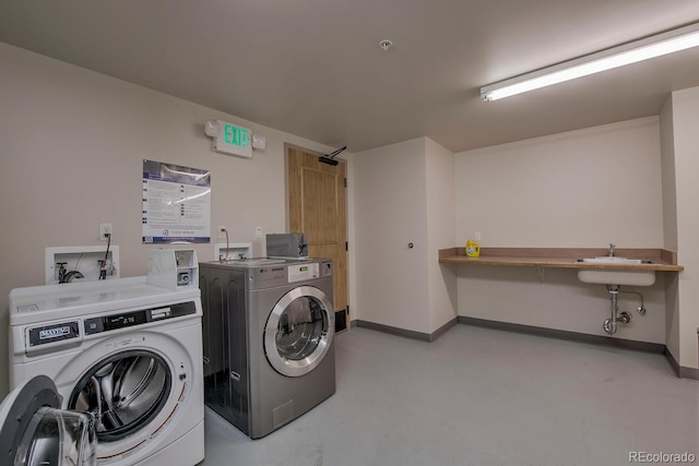 105 Wheeler Cir Unit 334, Frisco, CO 80443 - communal laundry room with washer and dryer and baseboards