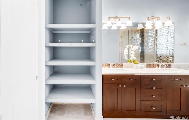 bathroom with walk in shower, tile patterned floors, and vanity