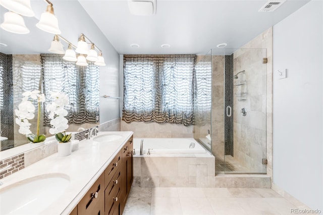 bathroom featuring independent shower and bath, tile patterned floors, and vanity