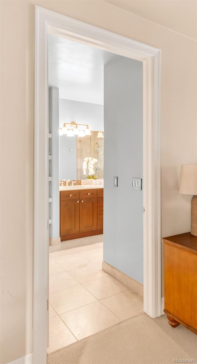 hallway featuring light tile patterned floors