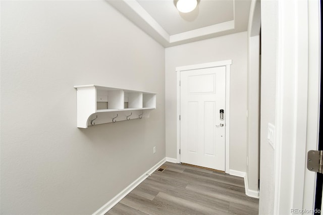 entryway with hardwood / wood-style flooring