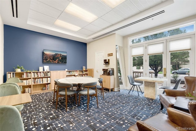 1827 N Grant St Unit 604, Denver, CO 80203 - carpeted dining space featuring healthy amount of natural light and a raised ceiling