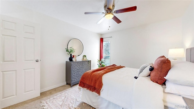 bedroom with baseboards, a ceiling fan, and light colored carpet