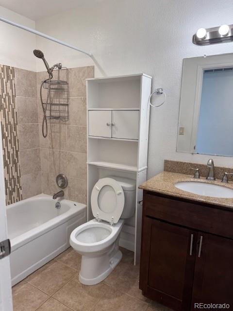 16753 E Ithaca Pl, Aurora, CO 80013 - full bath featuring vanity, shower / washtub combination, and tile patterned floors