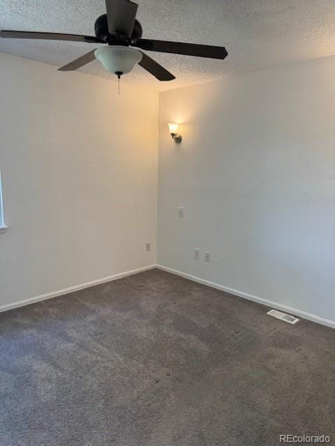 16753 E Ithaca Pl, Aurora, CO 80013 - empty room with a ceiling fan, dark carpet, and a textured ceiling