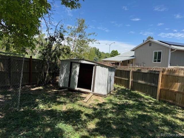 16753 E Ithaca Pl, Aurora, CO 80013 - fenced backyard with a storage shed