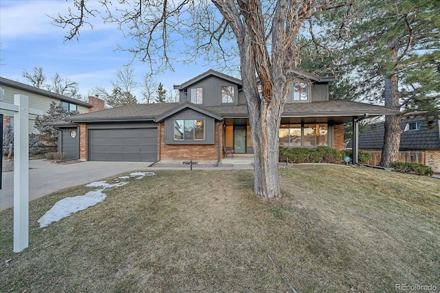 view of front of home with a garage, concrete driveway, brick siding, and a front yard