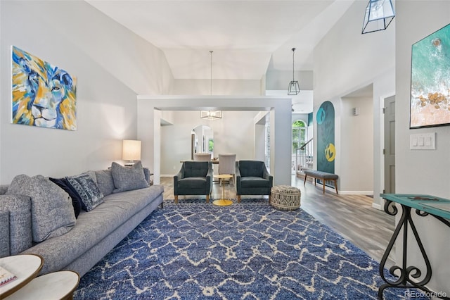 6468 S Forest St, Centennial, CO 80121 - living area featuring arched walkways and vaulted ceiling