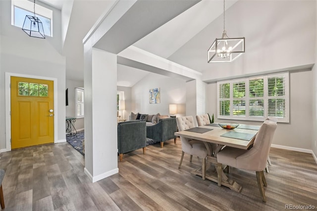 6468 S Forest St, Centennial, CO 80121 - dining room with a chandelier, high vaulted ceiling, and wood finished floors