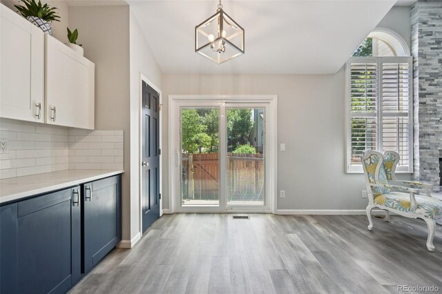 6468 S Forest St, Centennial, CO 80121 - entryway featuring a chandelier, light wood-type flooring, and lofted ceiling
