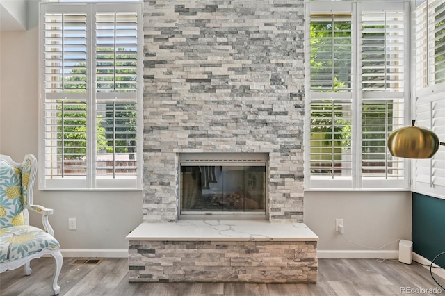 6468 S Forest St, Centennial, CO 80121 - living area with wood finished floors and a glass covered fireplace