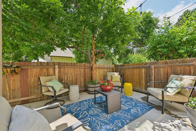 6468 S Forest St, Centennial, CO 80121 - fenced backyard with a patio area