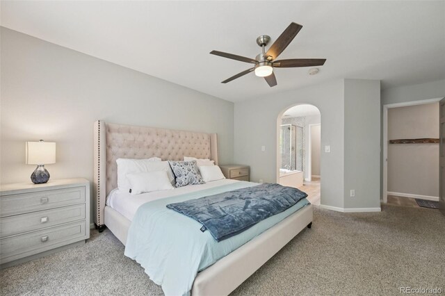 6468 S Forest St, Centennial, CO 80121 - bedroom featuring arched walkways, carpet floors, ceiling fan, and ensuite bath