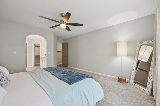 6468 S Forest St, Centennial, CO 80121 - carpeted bedroom with arched walkways, a ceiling fan, and a spacious closet