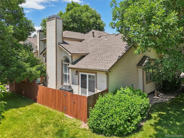 6468 S Forest St, Centennial, CO 80121 - back of house featuring a shingled roof and a chimney